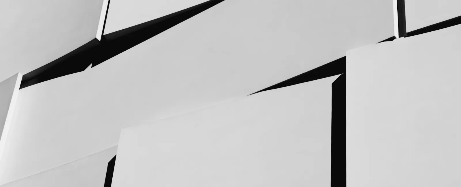 Abstract black and white geometric pattern with sharp angles and overlapping rectangular shapes