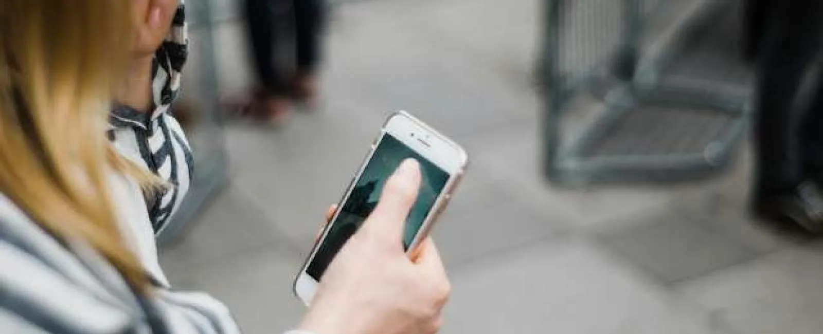 a woman holding a cell phone