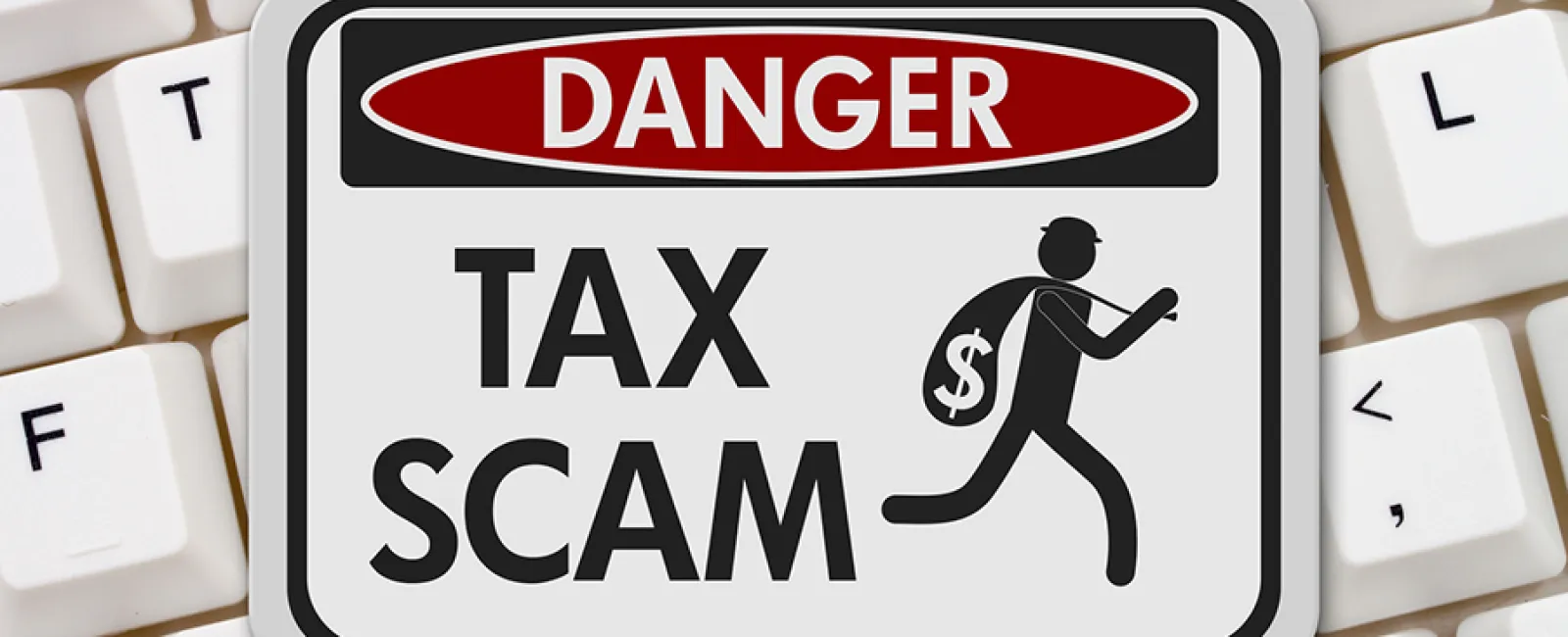 a sign showing a tax scam