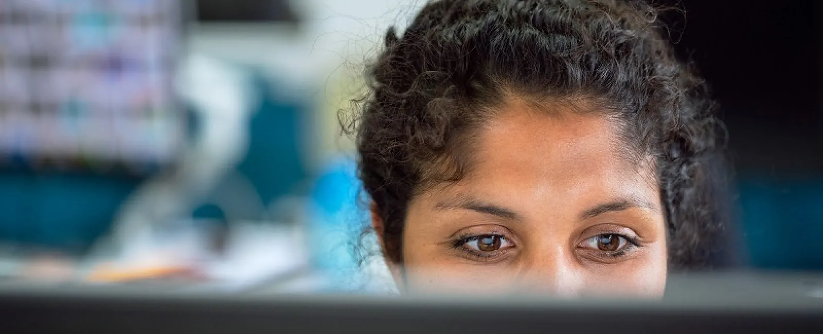 a woman looking at a screen