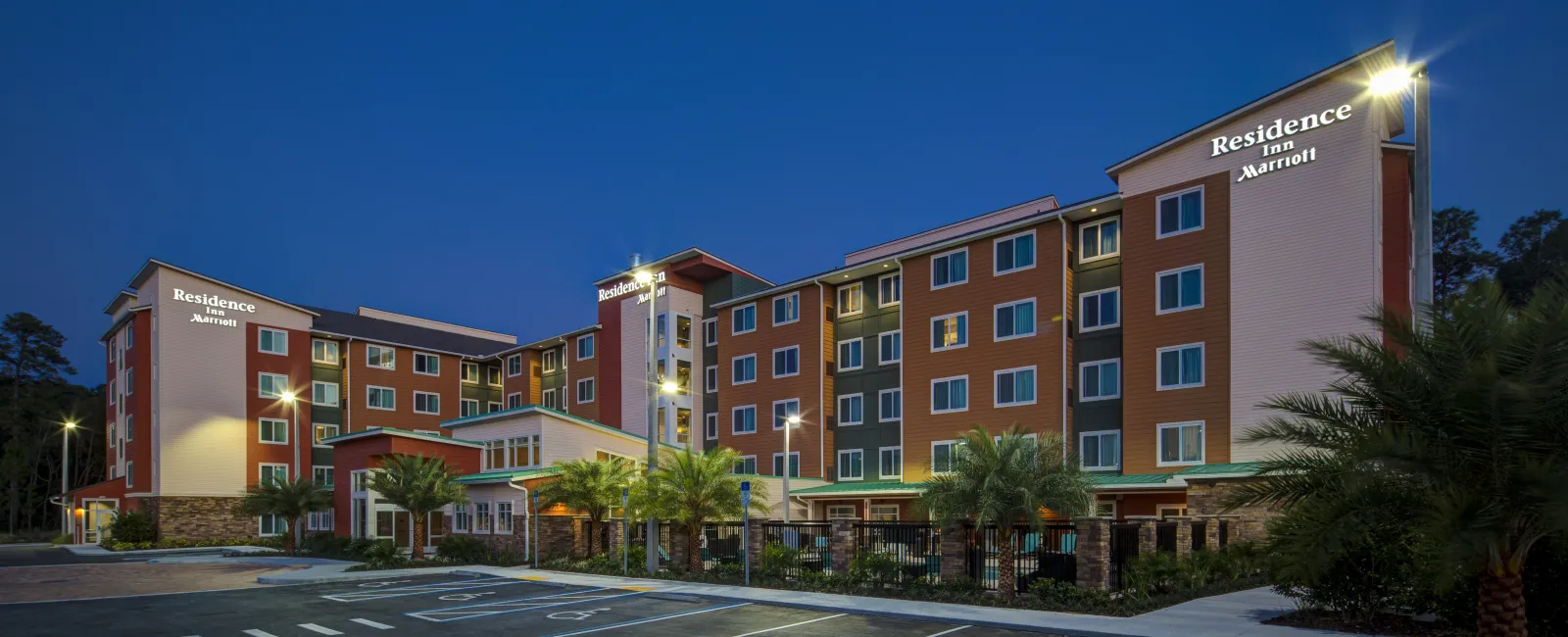 a large building with a parking lot