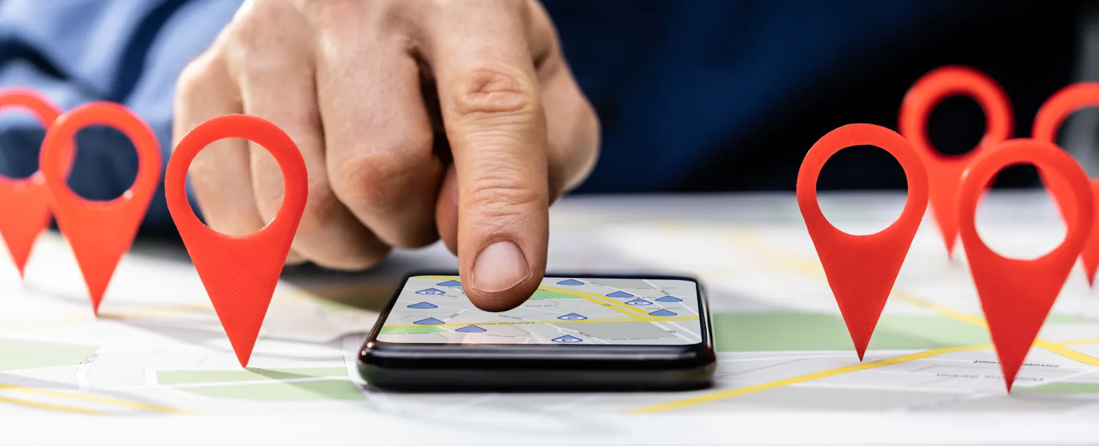 a hand holding a tablet