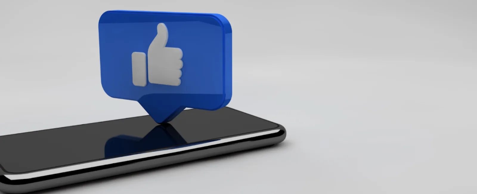 facebook like icon on top of a mobile phone