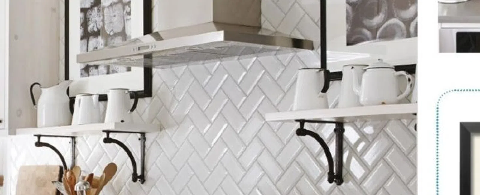 White kitchen with herringbone tile backsplash, stainless steel hood, open shelves with white ceramics, and glass jars.