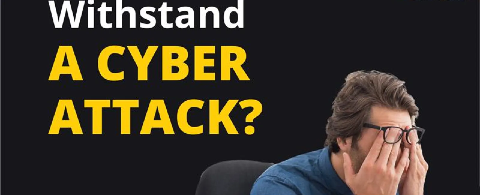 Man stressed at desk with cyber security alert graphics asking can your business withstand a cyber attack