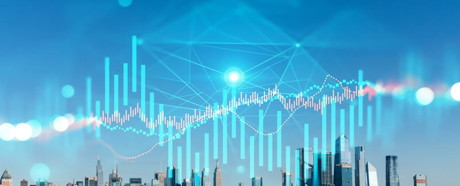 City skyline with digital stock market graphs and data overlays against a clear blue sky.