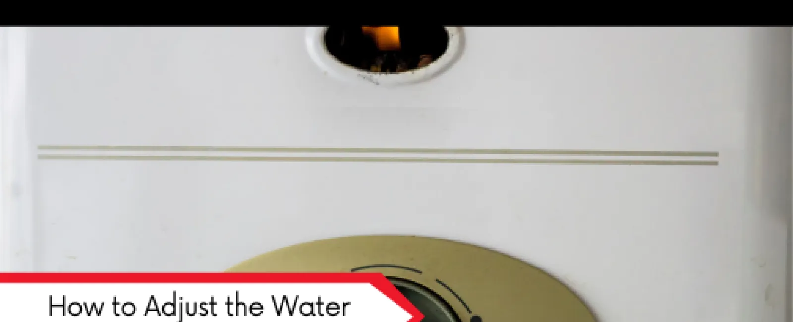 Close-up of a water heater dial with a flame visible in the burner, showing temperature adjustment knob.