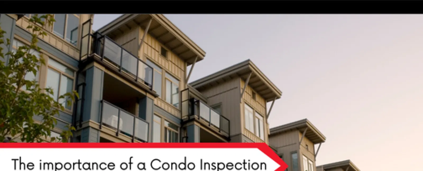 Modern multi-story condo building with balconies under a clear sky representing condo inspections importance.