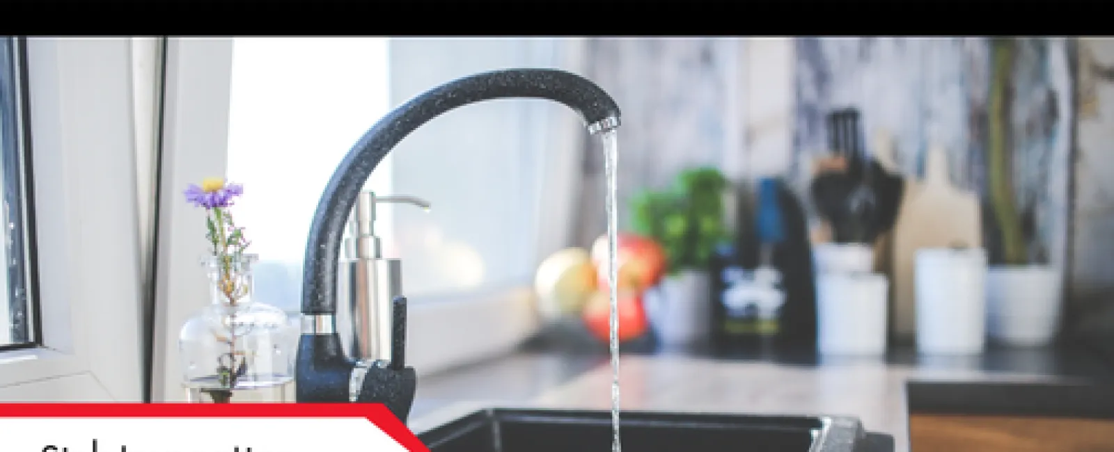 Modern kitchen sink with running water from black faucet and soap dispenser near window with flower vase