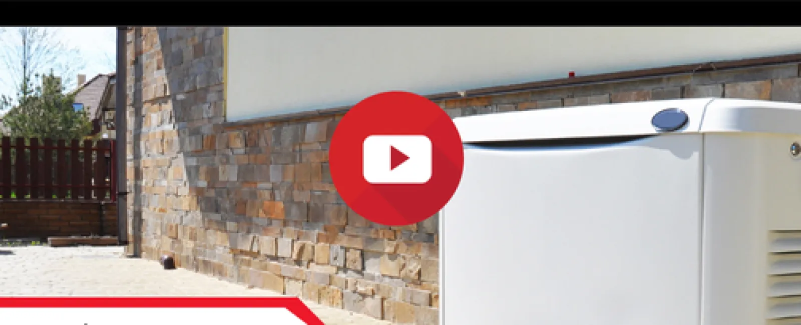 Outdoor backup generator installed beside a stone wall on a paved driveway with a red play button overlay.