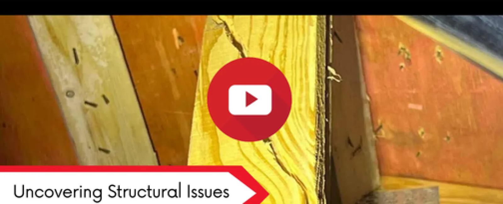 Close-up of cracked wooden beam inside a house highlighting structural issues for inspection.