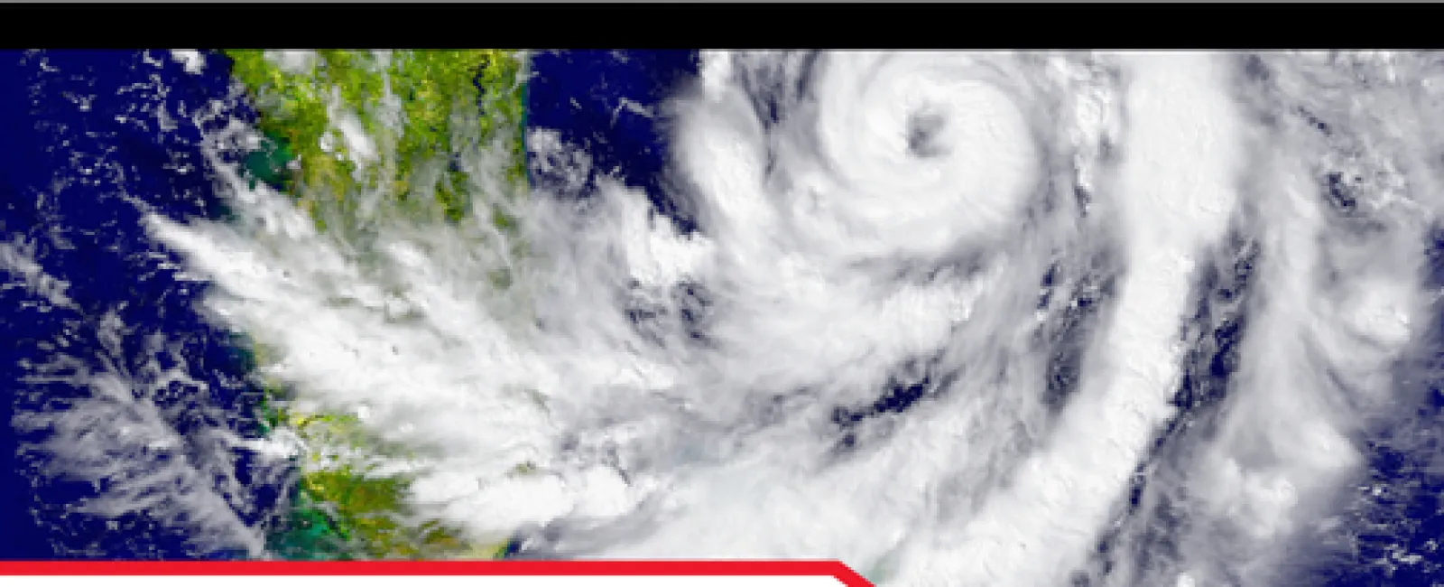 Satellite view of a hurricane with swirling clouds illustrating the need for secure home bolt tie-downs in storm areas.