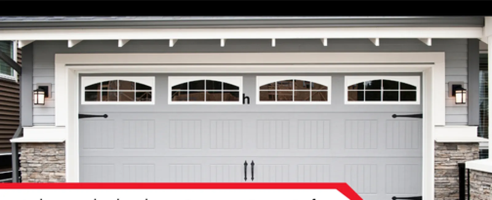 Grey garage door with windows, stone pillars, and text banner about garage door safety check.