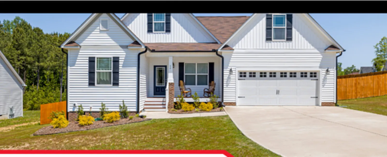 Bright white split-level house with garage and lawn featured in home inspection service image.