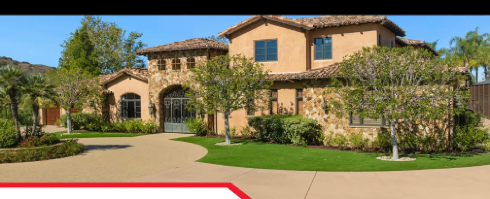 Beautiful stone and stucco two-story home with manicured lawn promoting Southeast home inspections.