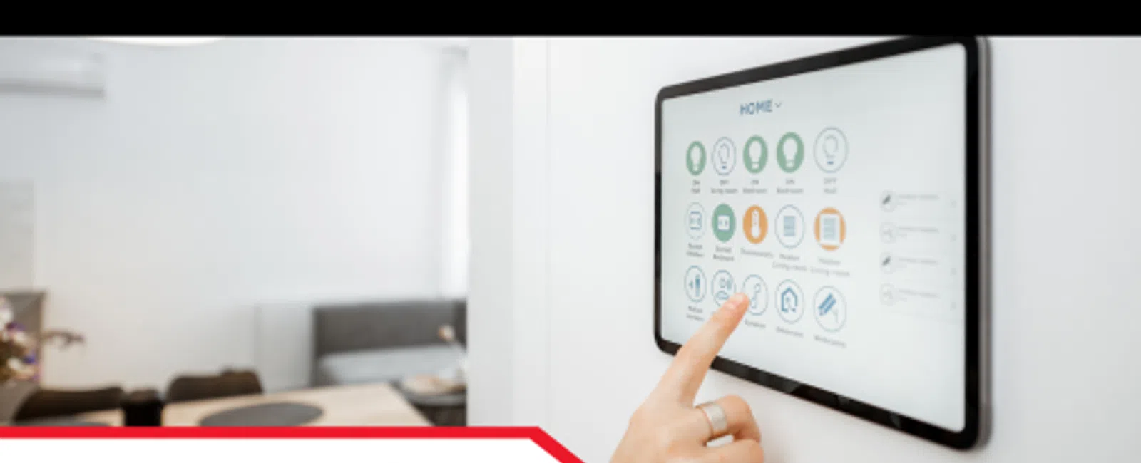 Person using a smart home touchscreen panel to control various home settings in a modern living space.