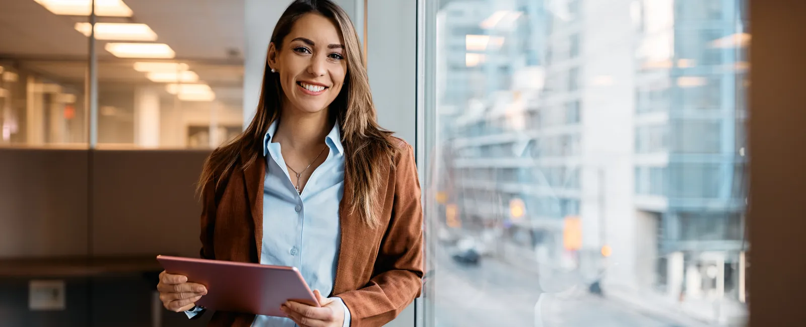 a woman holding a tablet