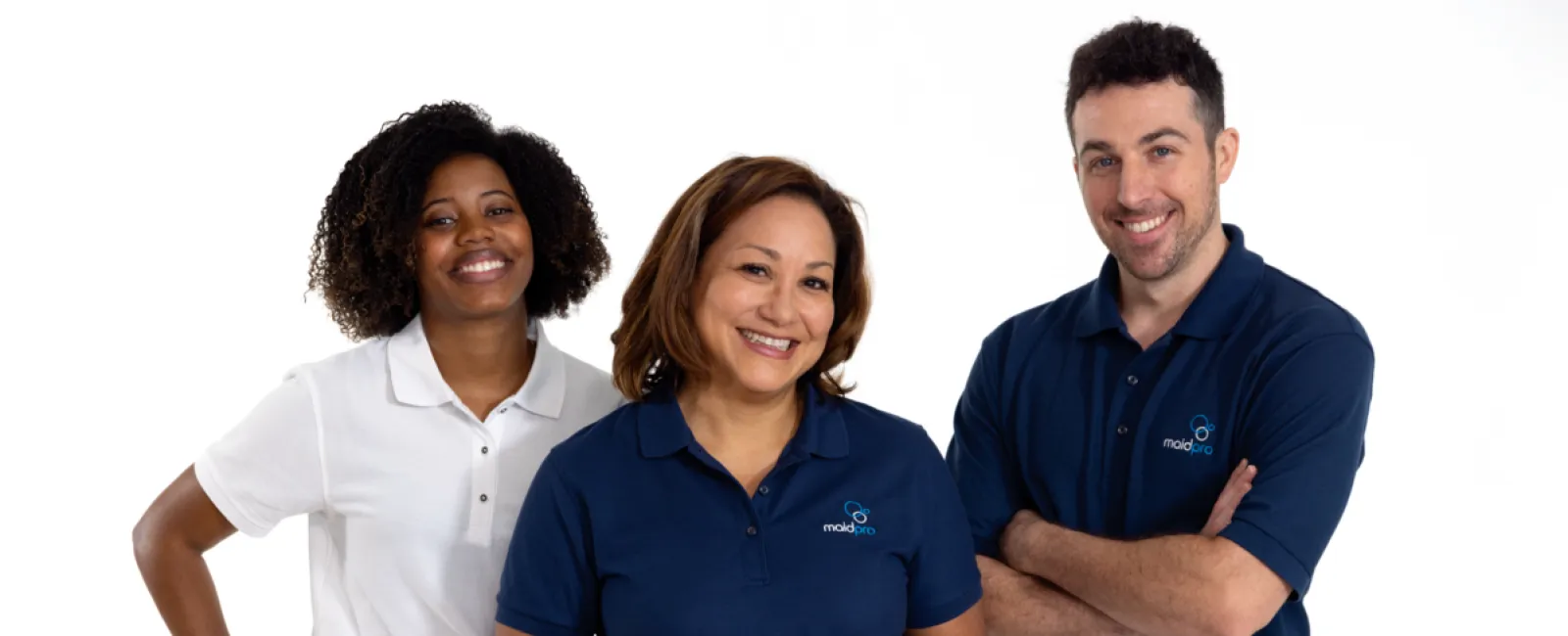 Three smiling cleaning staff wearing MaidPro uniforms standing against a white background.