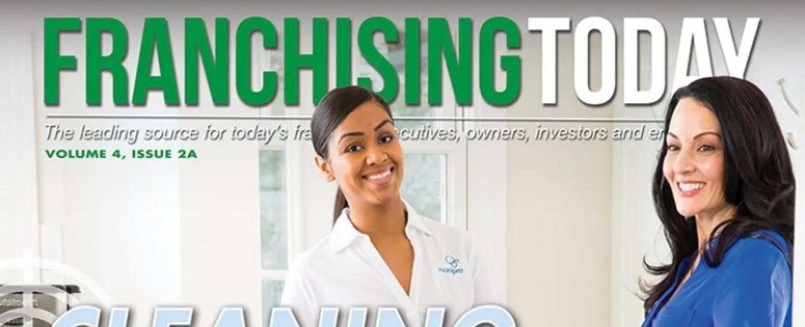 Two women smiling inside a home; one holds a MaidPro cleaning caddy, featured on Franchising Today cover.
