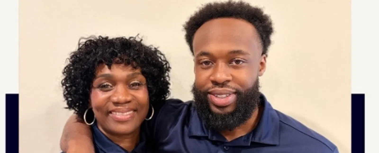 Mother and son franchise owners Linda and Tyrese Watson smiling together in matching Maid Pro uniforms.