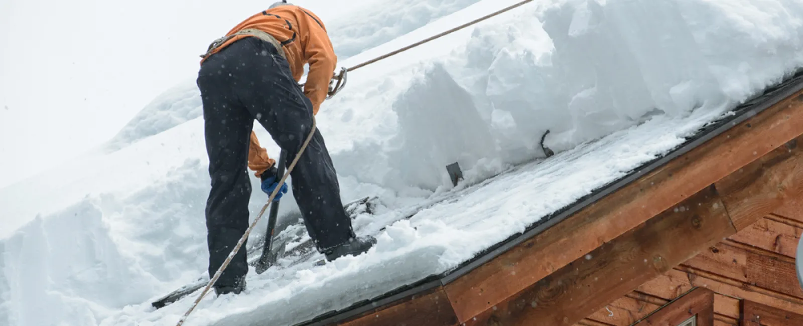 a man on skis on a roof