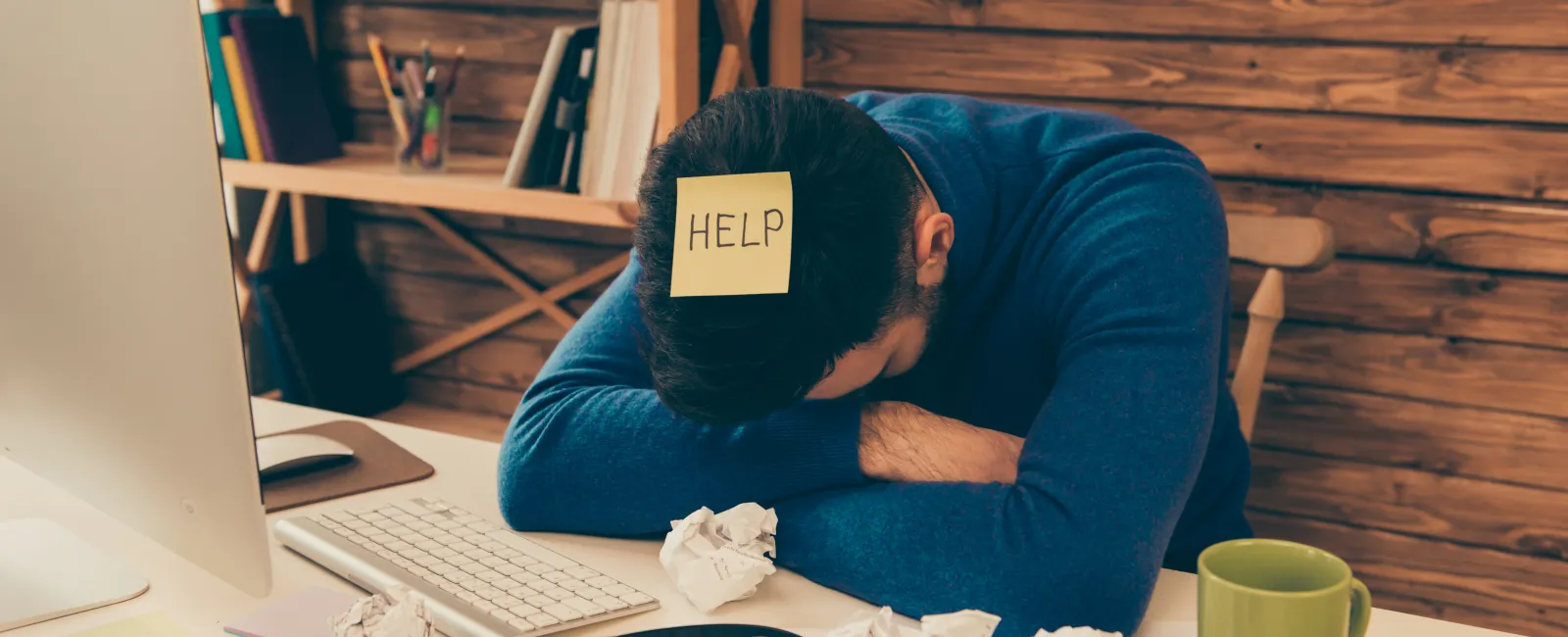 a person sleeping on a desk