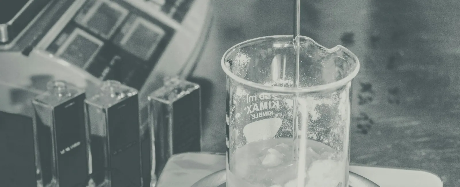 Laboratory scene with a beaker as liquid is poured, demonstrating precise measurement techniques.