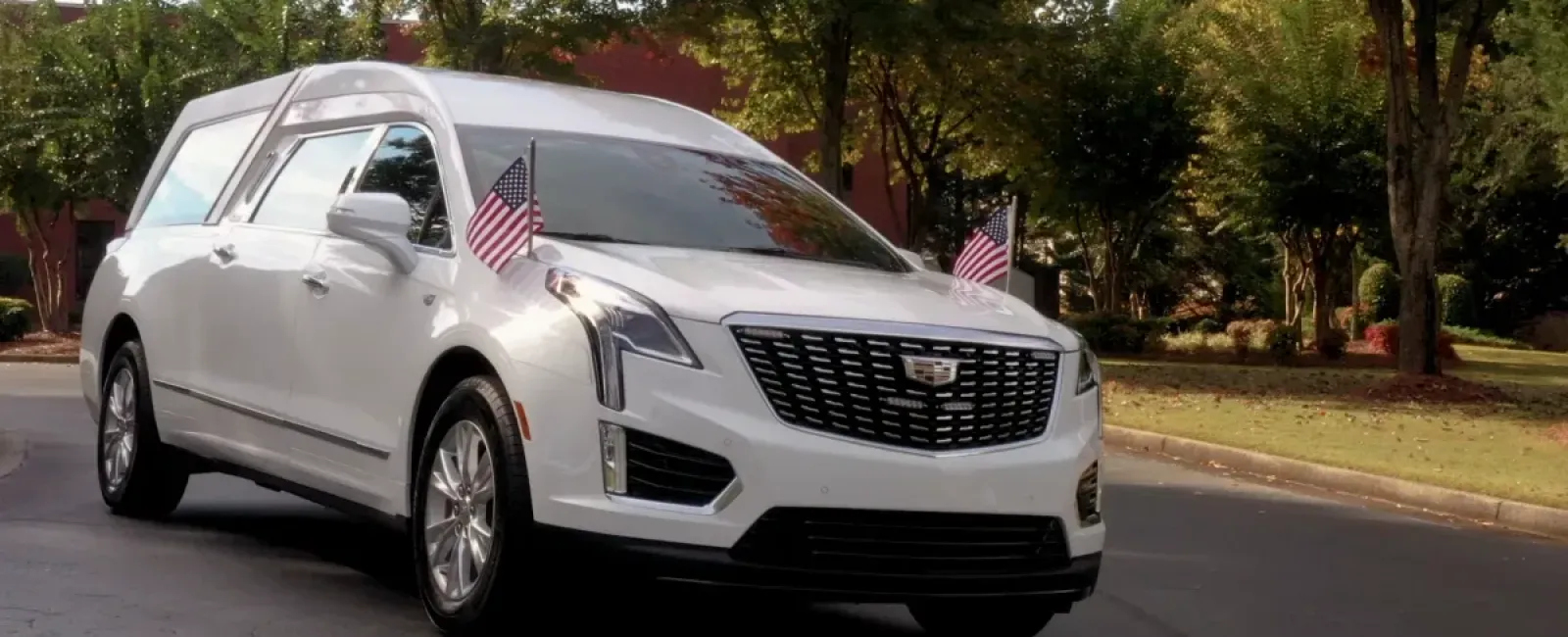 a white car with a flag on the roof