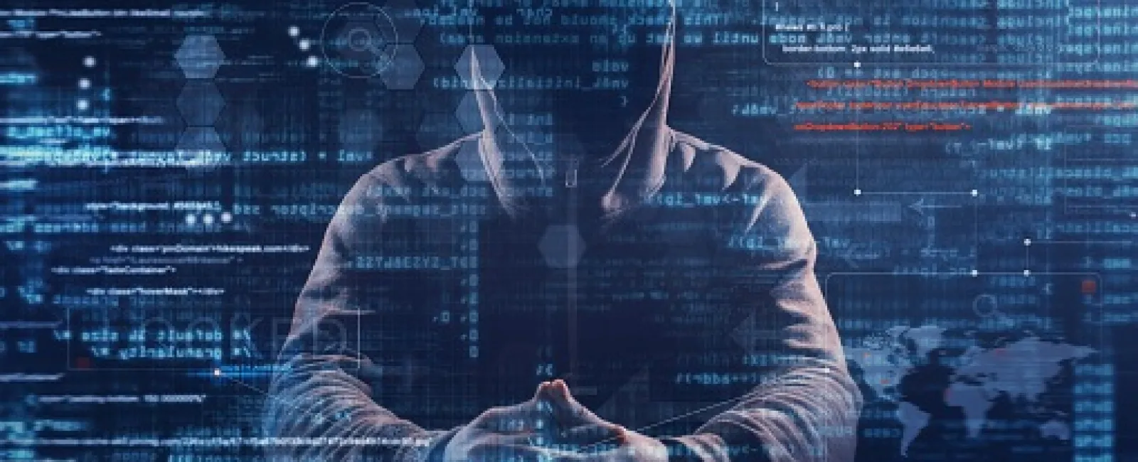 Hacker in hoodie working with digital code and cybersecurity data overlay in dark environment.