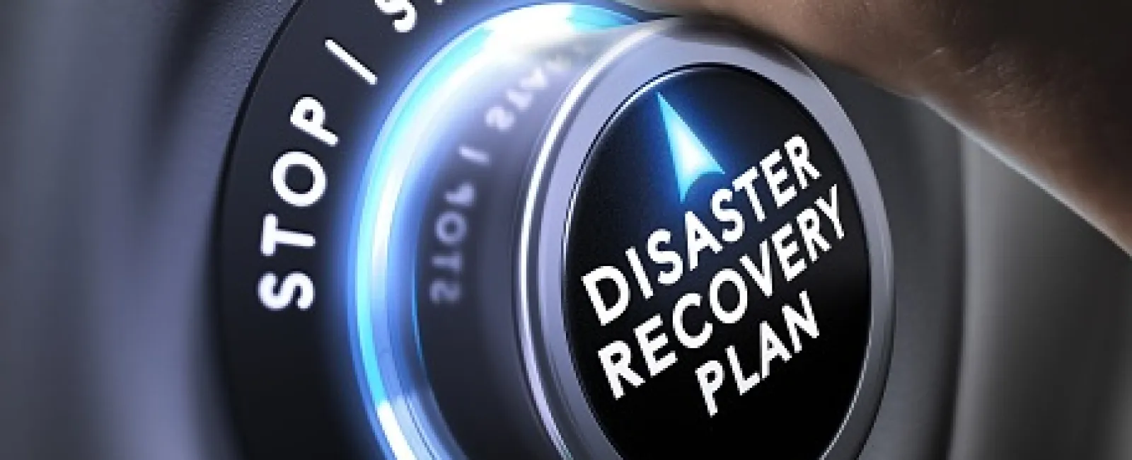 Hand turning a knob labeled Disaster Recovery Plan with illuminated stop and start indicators