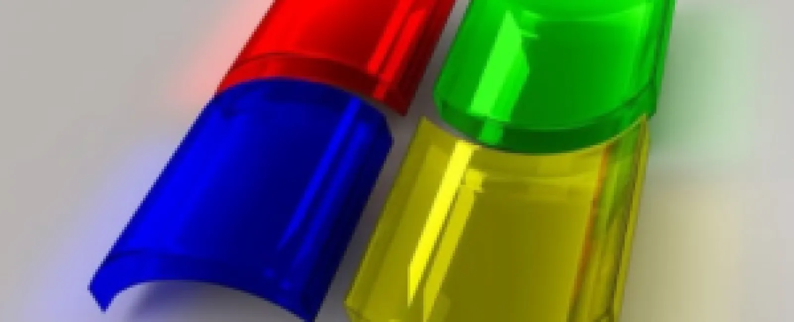 3D translucent plastic Windows logo with red, green, blue, and yellow curved squares on gray background