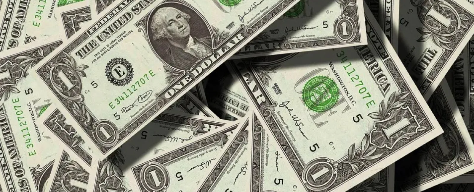Big pile of one dollar bills