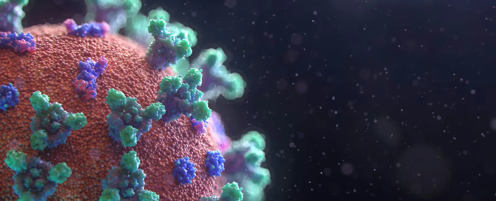 Close-up 3D rendering of a coronavirus particle with spike proteins on a dark background with light particles.