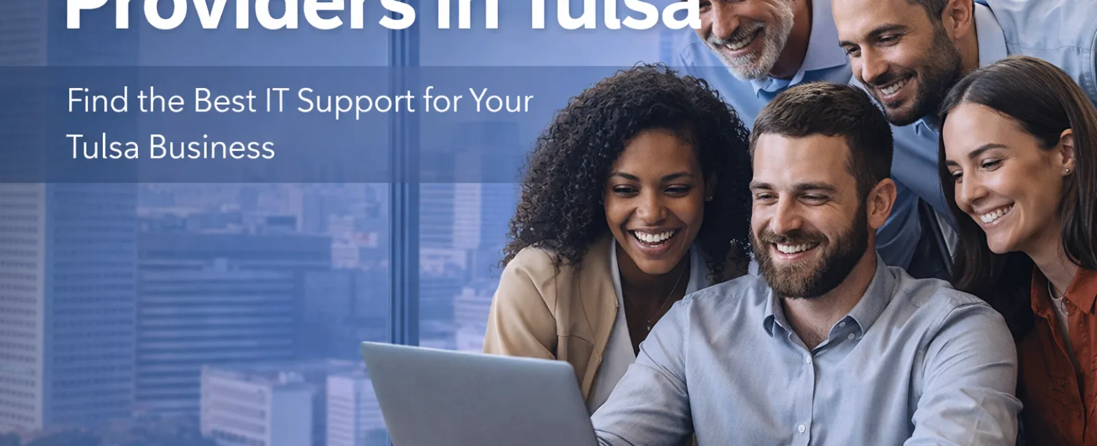 Smiling diverse business team gathered around laptop illustrating top IT support providers in Tulsa for businesses.
