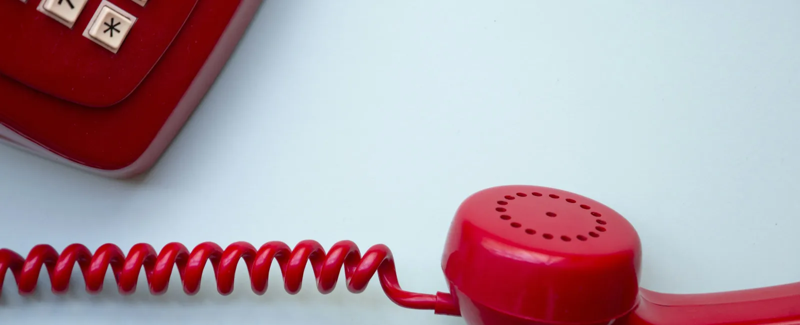 a red cord plugged into a red device