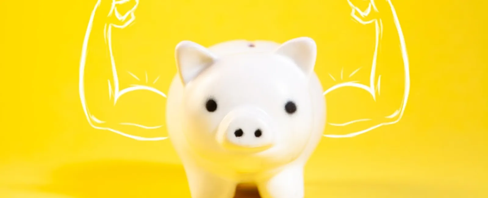 White piggy bank with drawn muscular arms on yellow background symbolizing strong finances and savings.