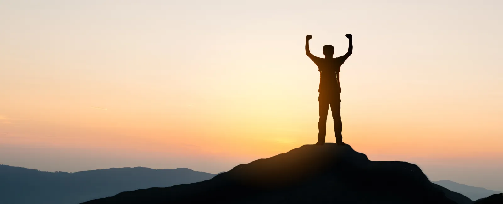 a person standing on a mountain