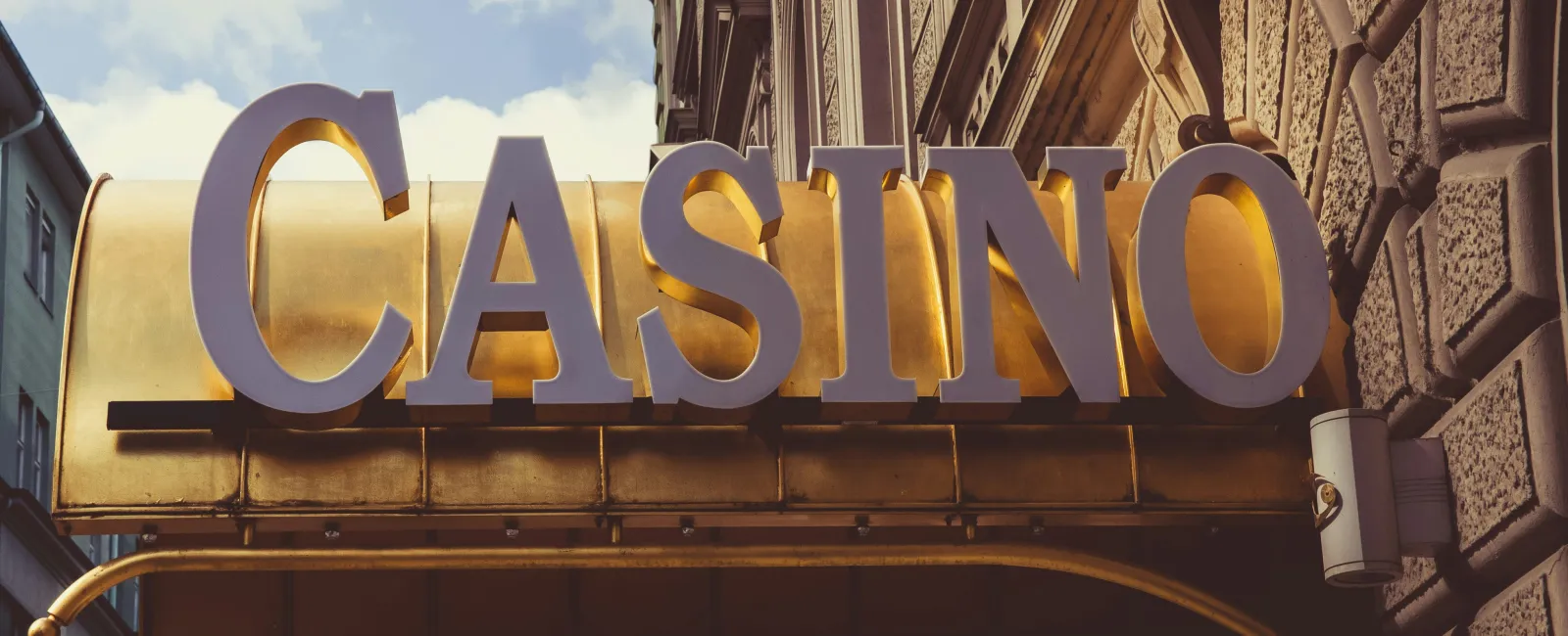 Large gold and white casino sign mounted on ornate building exterior where an MSP failed a casino