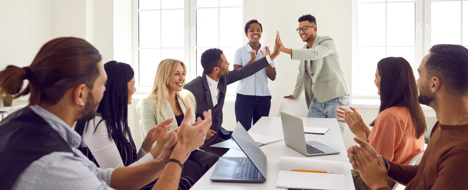 a group of people in a meeting