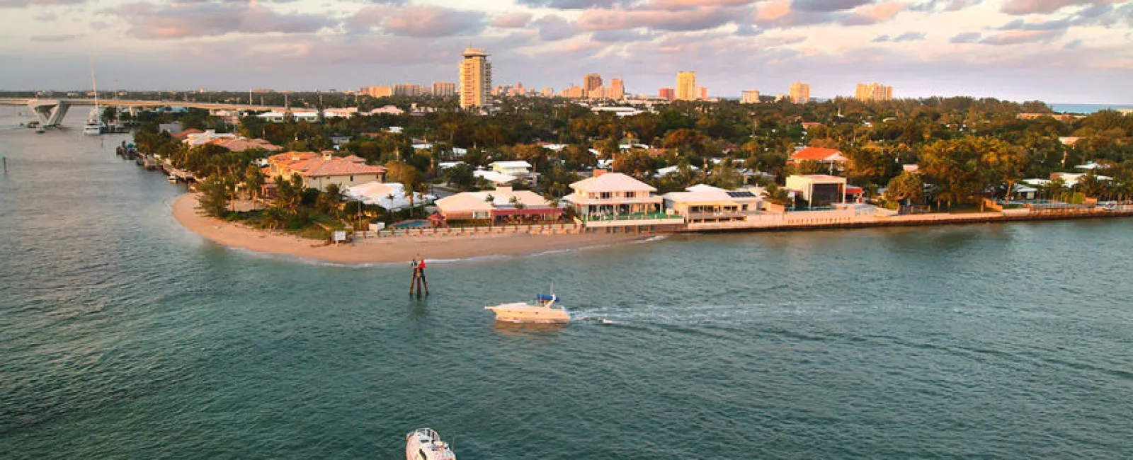 a body of water with boats and buildings along it