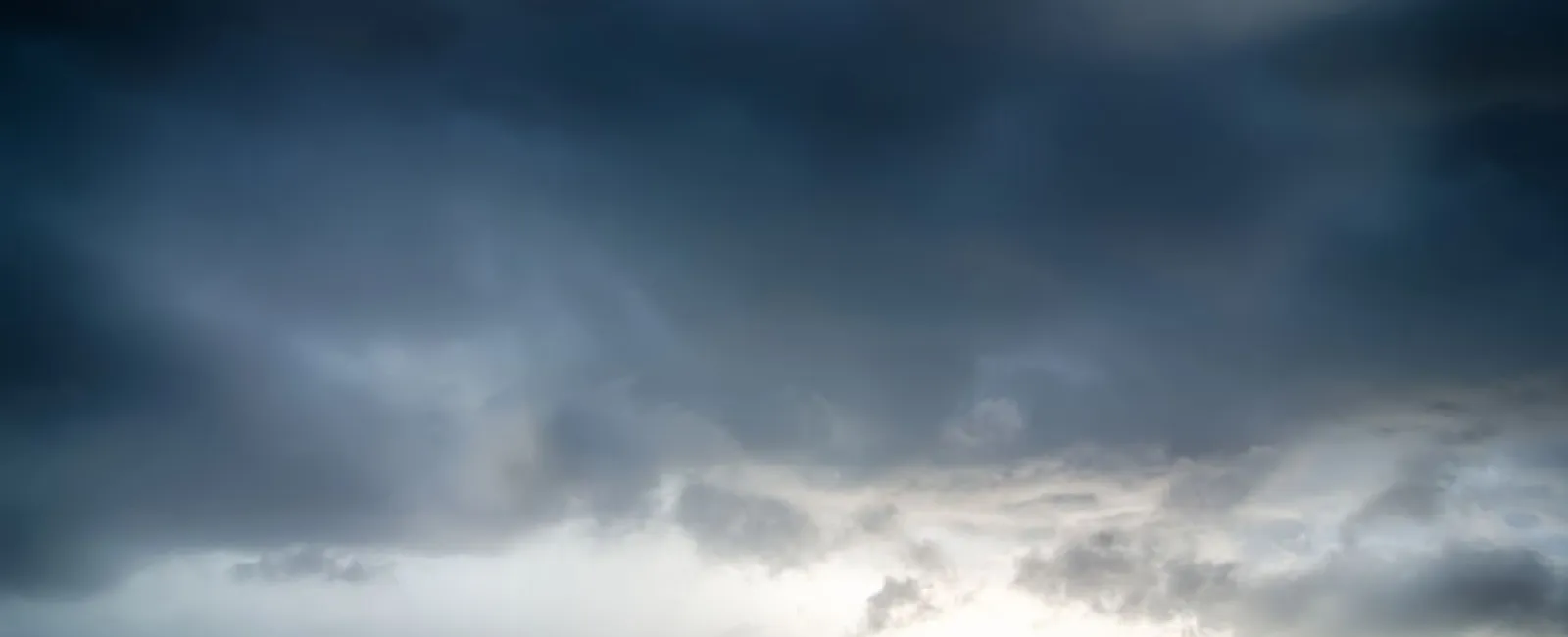 a beach with a cloudy sky