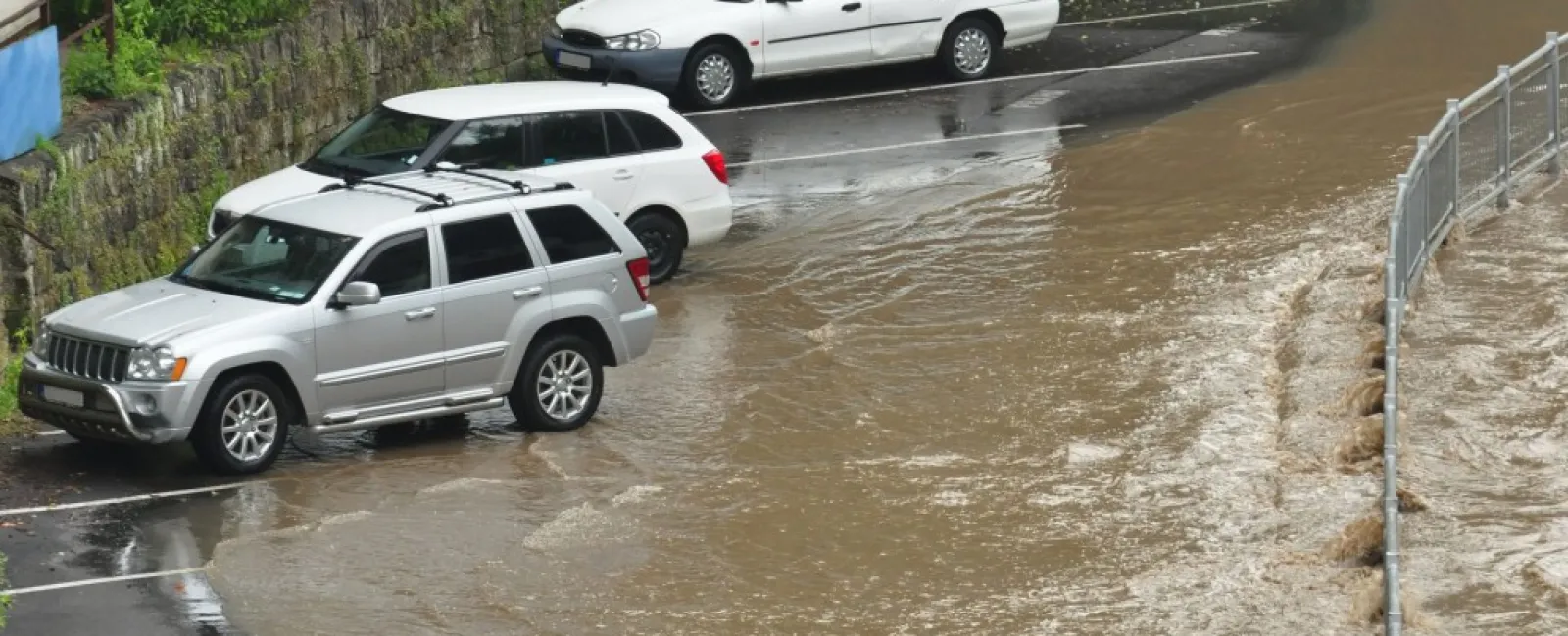 a group of cars parked in a flooded street