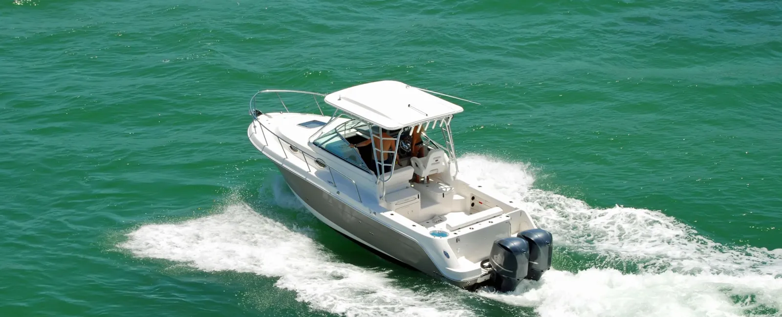 a boat travels through the water