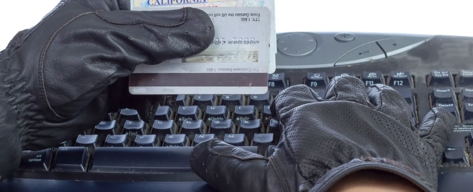 a person in a glove and gloves on a typewriter