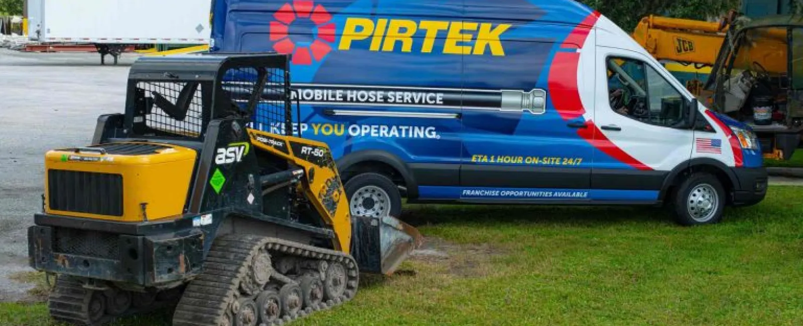 Pirtek mobile hose service van parked on grass next to a yellow ASV RT-50 compact track loader.