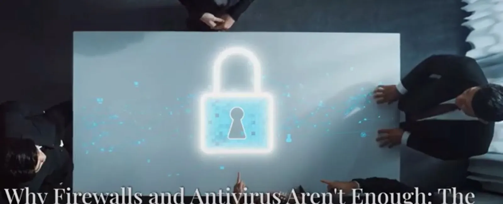 Business professionals discussing cybersecurity with holographic lock symbolizing multi-layered protection