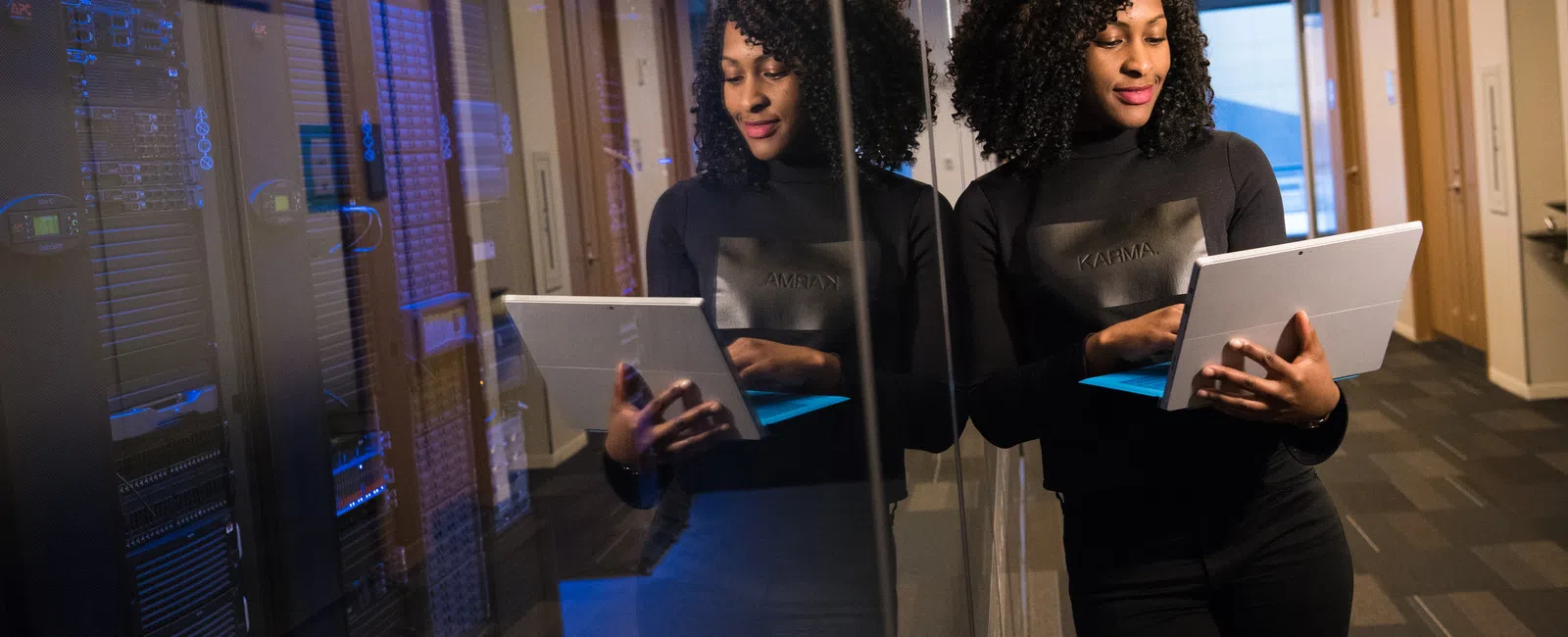 a few women looking at a laptop