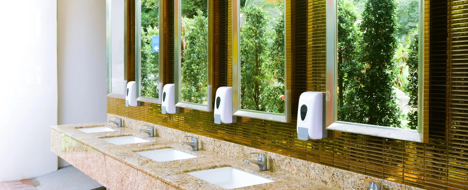 a white sink sitting under a mirror next to a window