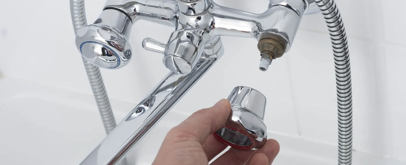 hand holding faucet