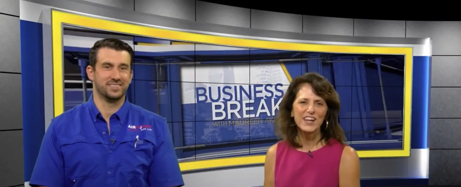 Male technician and female host on Business Break TV segment promoting AirForce Heating and Air services.